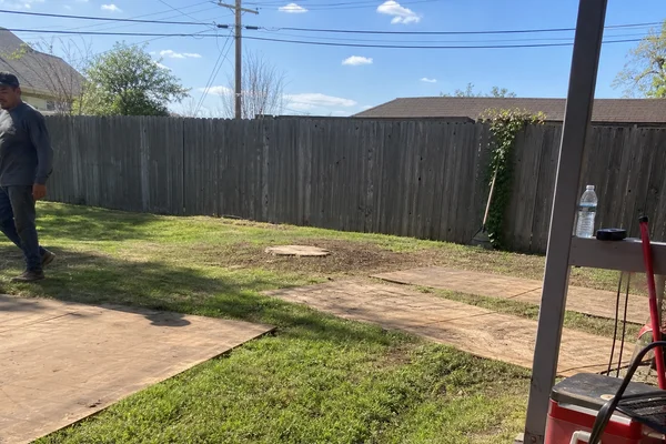 Cleared lot with ground protection mats after removal